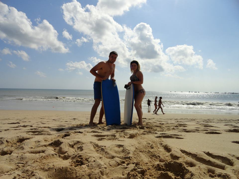 Couple body board on Jimbaran Beach