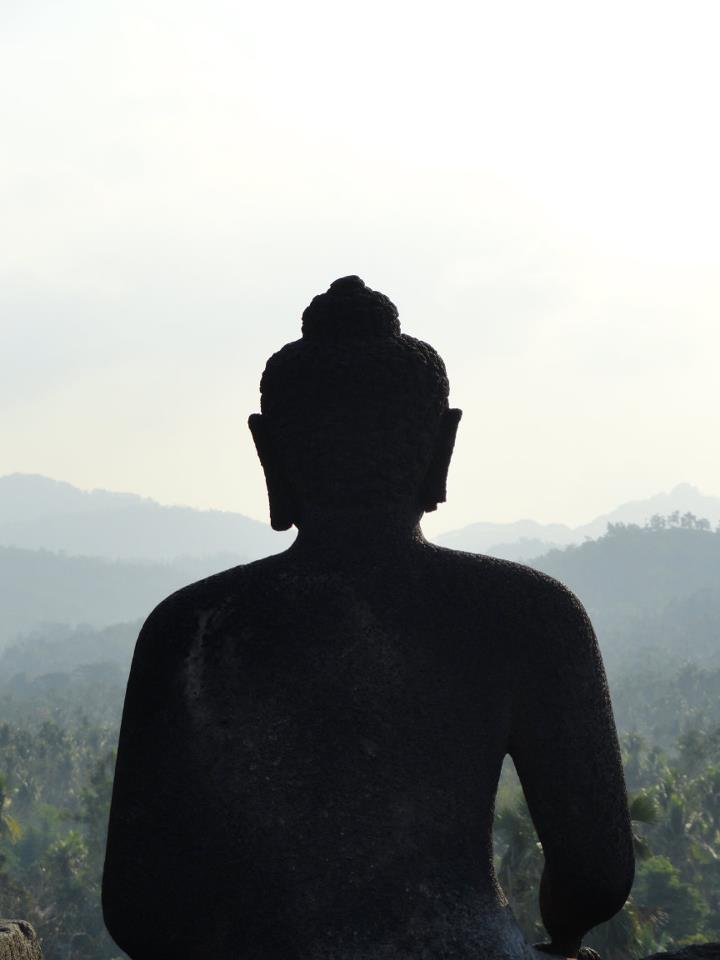 Statue over looking the landscape at Borobudur Temple