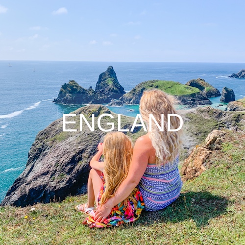 Mother and daughter sit at Lizard Point UK