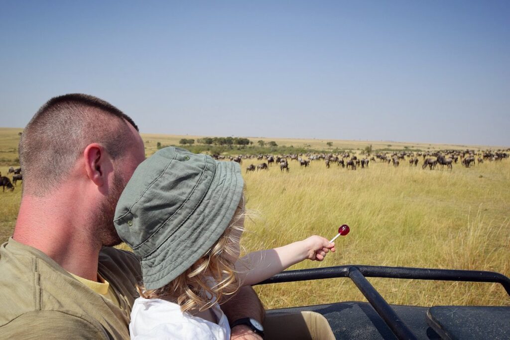 Father and daughter on safari in the Masai Mara