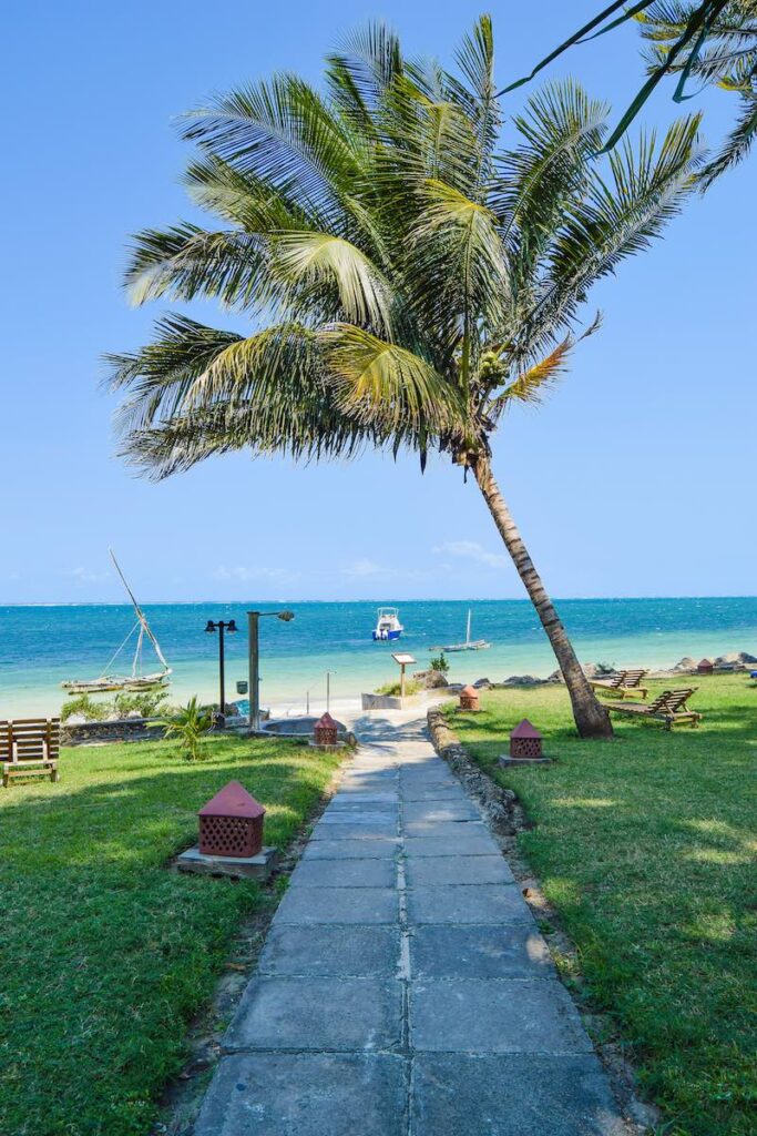 A path goes through the grounds of Severin Sea Lodge, and emerges out on a white sand beach, with turquoise water