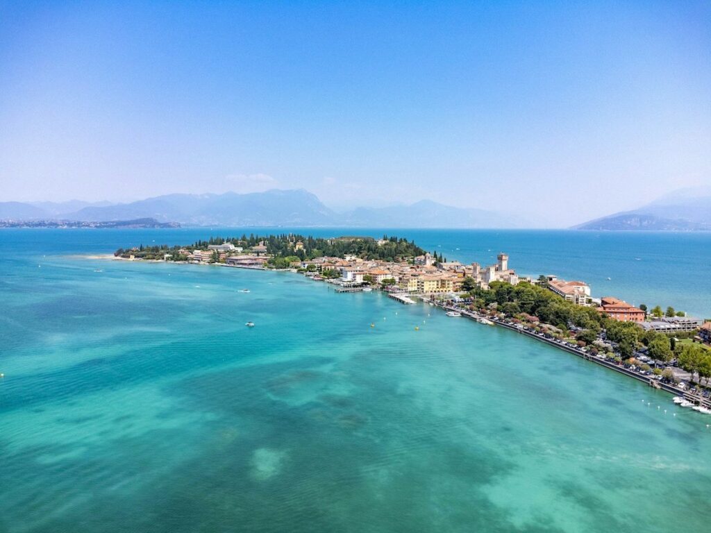 Sirmione peninsula surrounded by aqua water