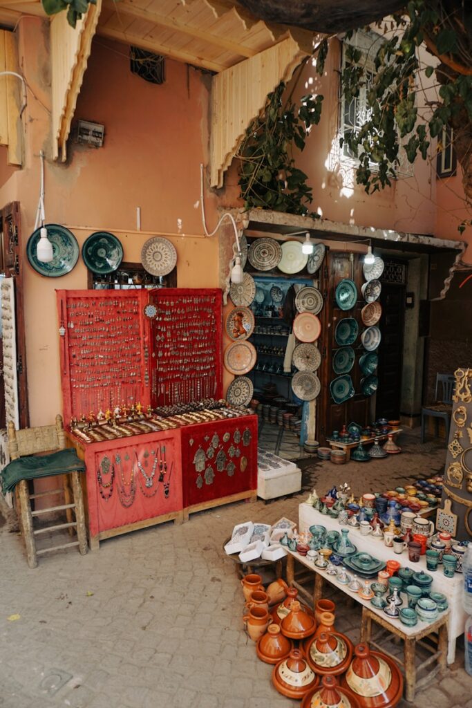 a Moroccan store with lots of pottery and plates on display