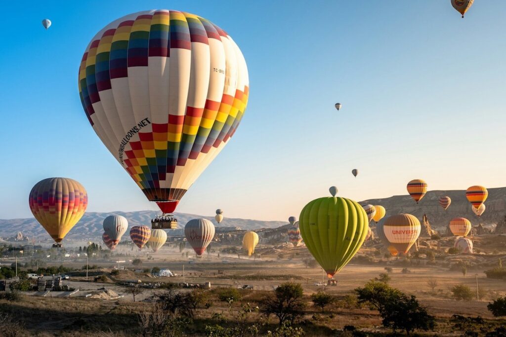 Colourful hot air balloons flying in Cappadocia