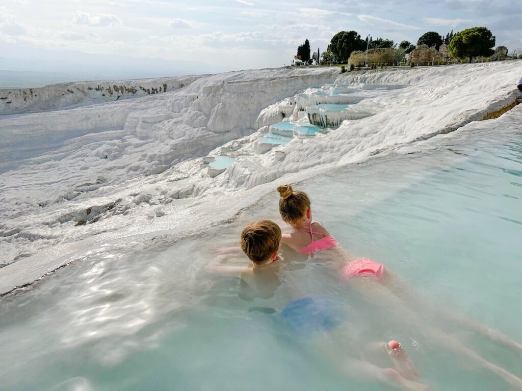 Two children swim in Pamukkale 