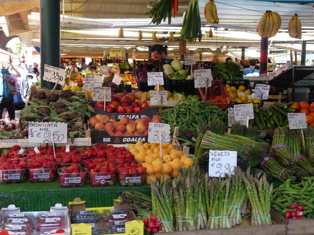 Fresh colourful fruit and vegetables displayed at Rialto Market in Venice