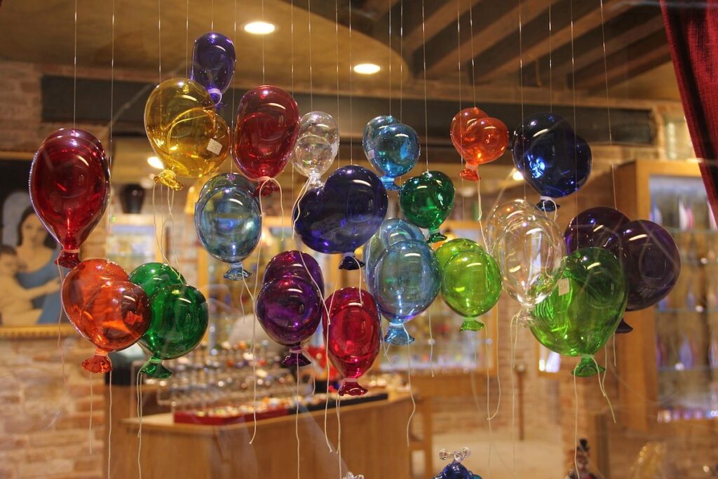 Colourful glass-blown balloon ornaments on display in a Murano Island shop, Venice