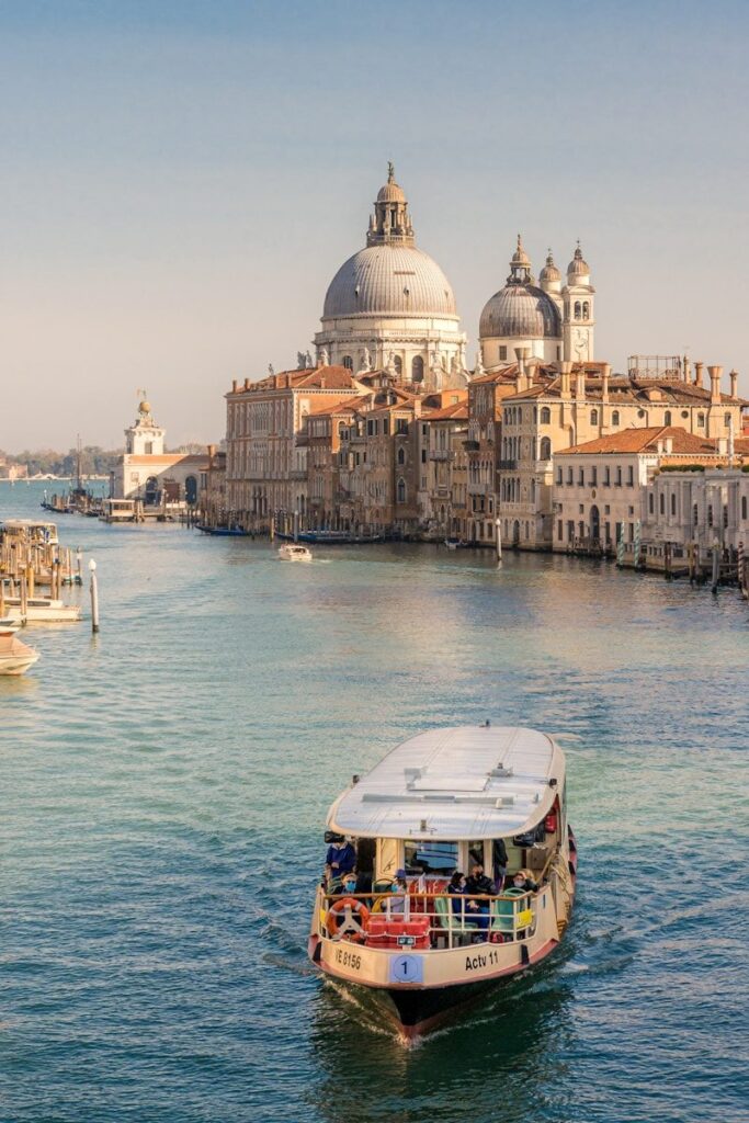 Vaporetto boat cruising along the Venice canal – Venice with kids