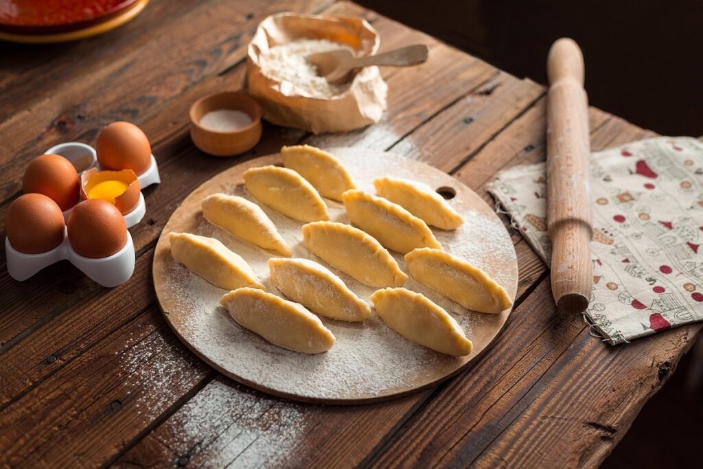 Making fresh pasta together at a Venetian cooking class in Italy