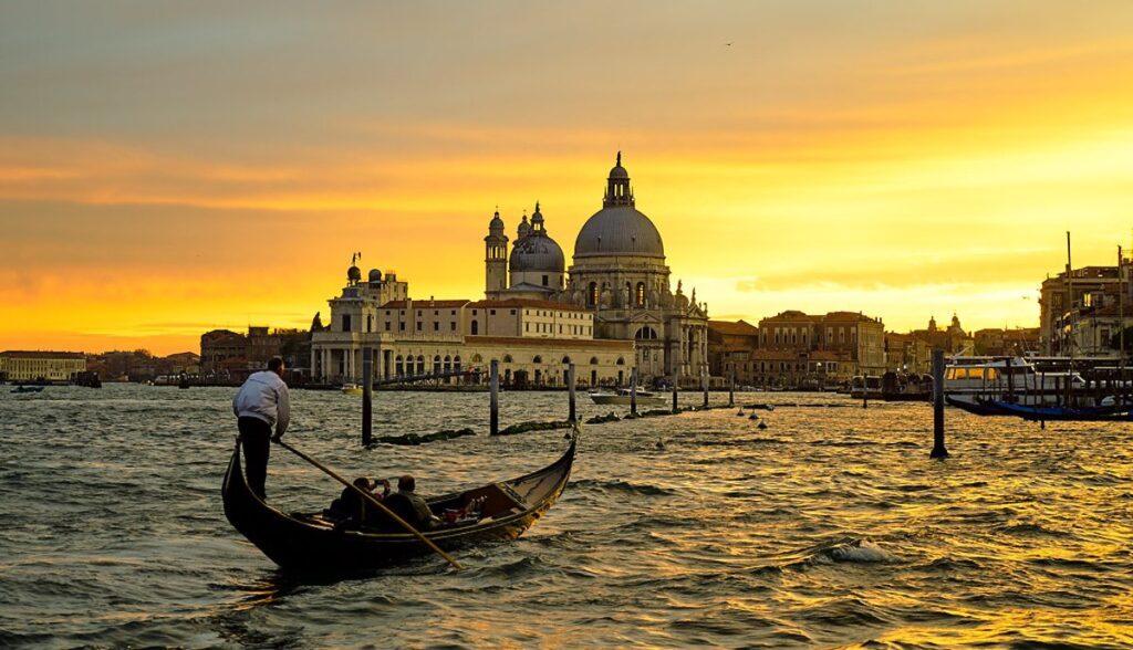Sunset casting a golden glow over the canals of Venice, Italy