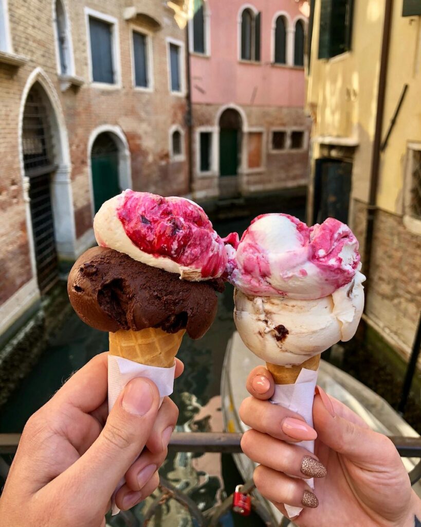 Ice creams with Venice canal in the background"