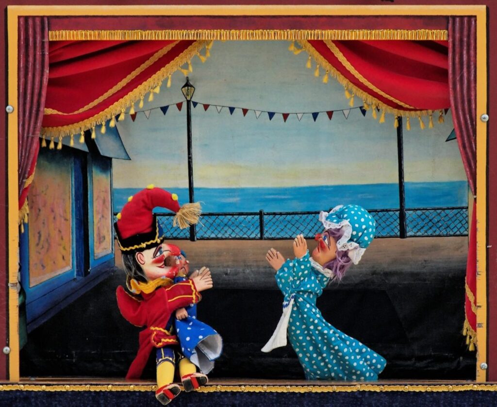 Traditional Venetian puppet show performance with colourful puppets on stage