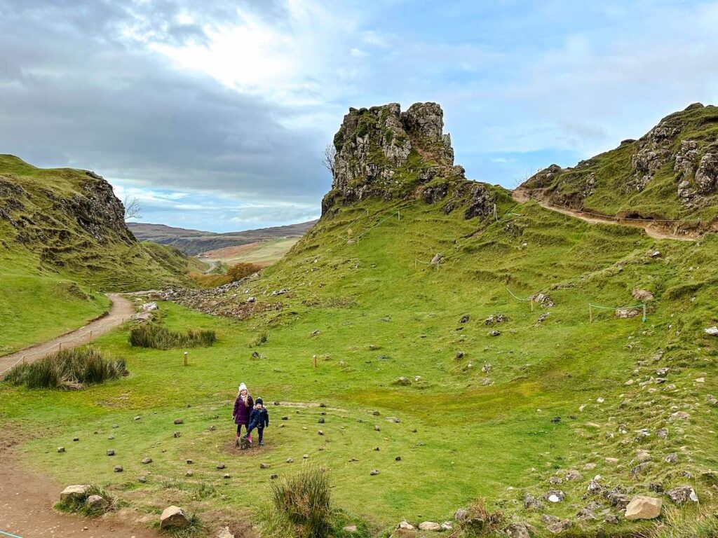 Siblings standing in the Fairy Glen on the Isle of Skye, Scotland