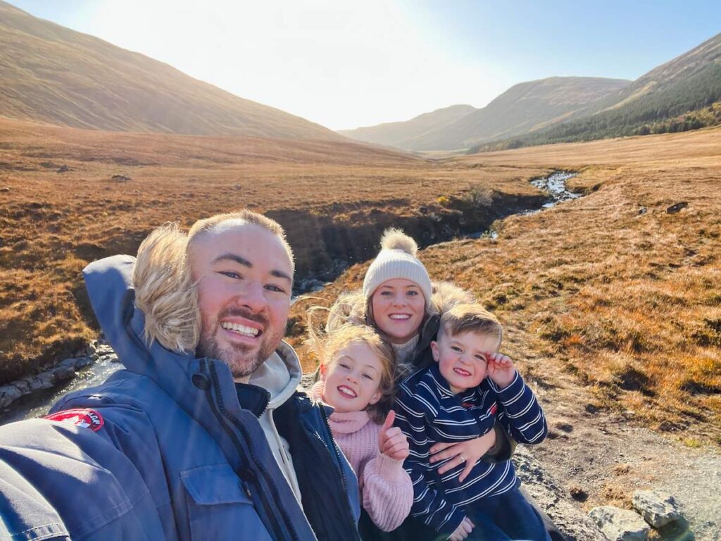 Family exploring the Fairy Pools on the Isle of Skye, Scotland