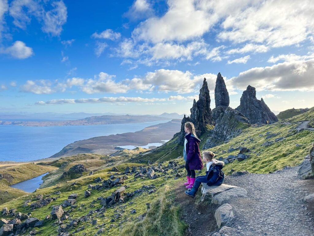 Children standing at the top of the Old Man of Storr, Isle of Skye