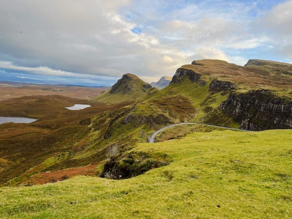 Family sitting at the Quiraing on the Isle of Skye, Scotland