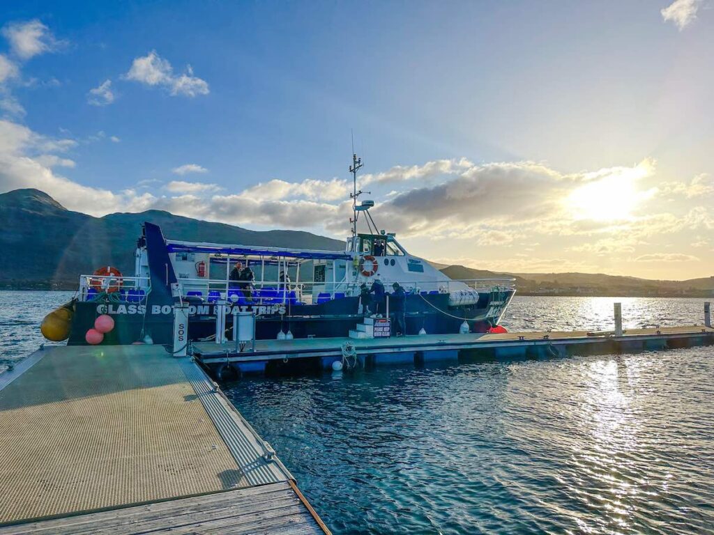 SeaProbe Atlantis glass-bottom boat on the Isle of Skye, offering passengers views of marine life and Skye’s mountains.