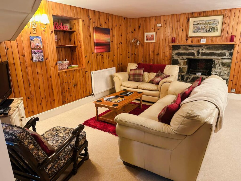 Interior of a traditional Scottish cottage on the Isle of Skye with cozy decor and warm natural light.