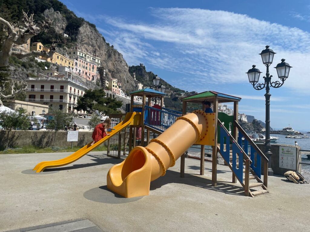 Children playing in a playground in Amalfi on the Amalfi Coast in Italy.
