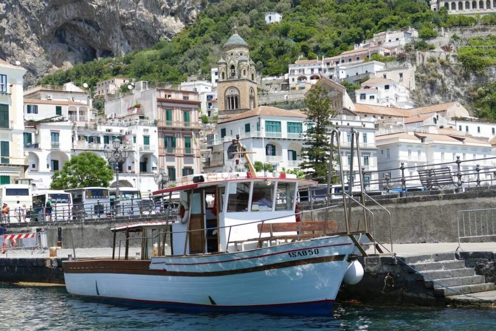 Private transfer boat cruising along the Amalfi Coast in Italy.